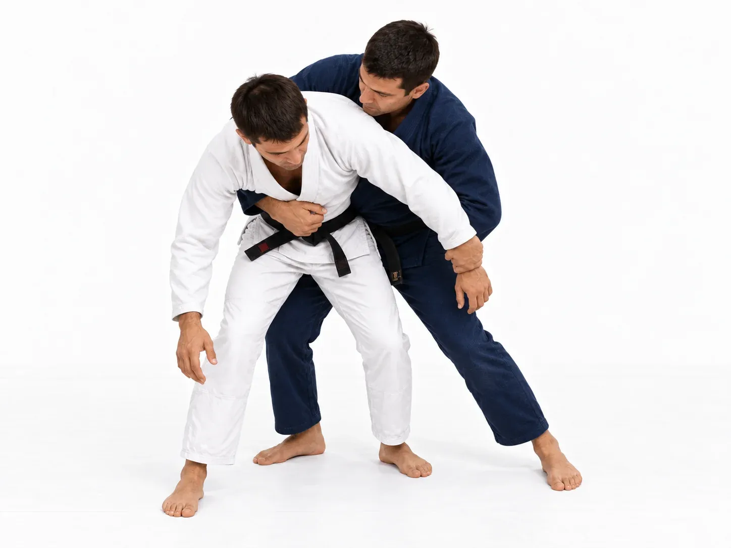 The attacker arriving behind the opponent’s shoulder with a hand across the chest.