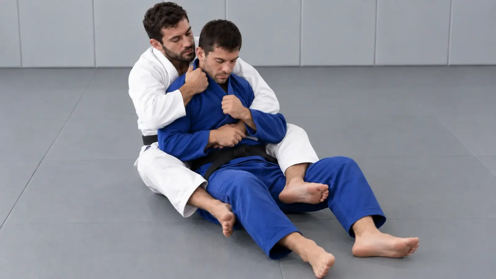 Back control with a deep collar grip taken across the opponent’s neck.