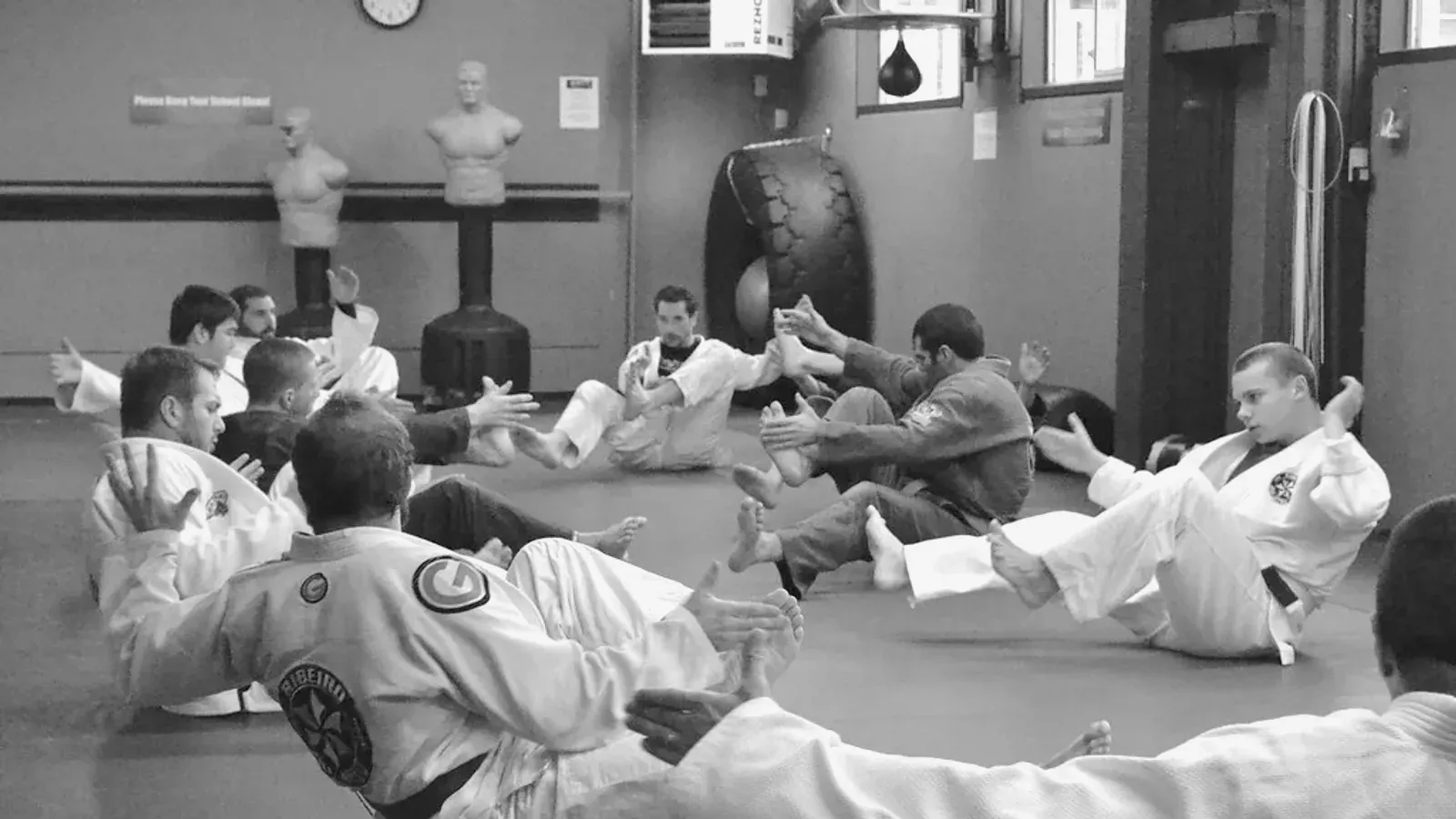Brazilian Jiu Jitsu practitioners during a class rolling.