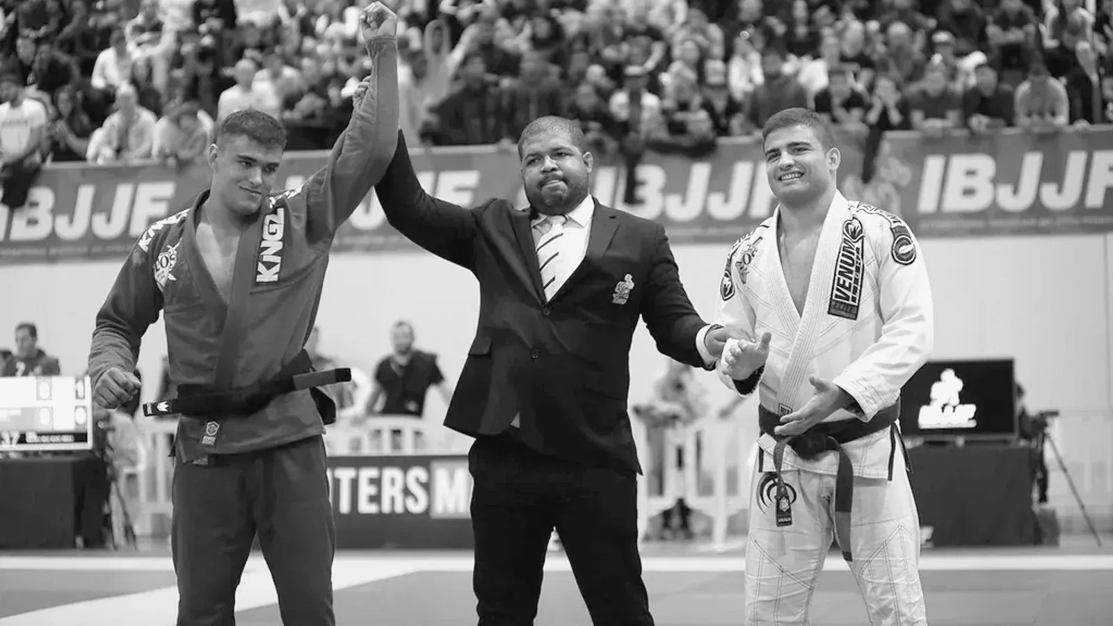 Brazilian Jiu Jitsu practitioners competition atmosphere while training on the mat.