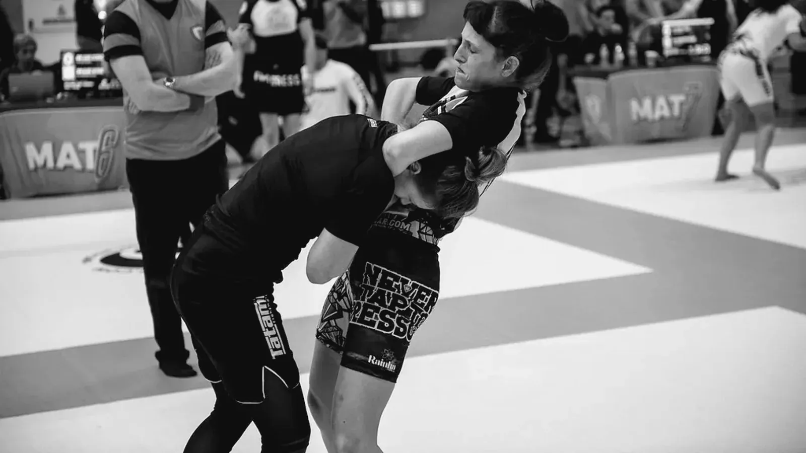 Brazilian Jiu Jitsu practitioners women training while training on the mat.