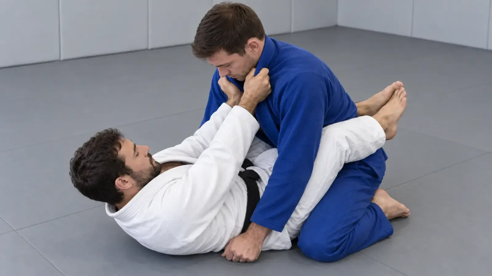 Both hands deep in the collar, elbows drawing in as the choke closes.