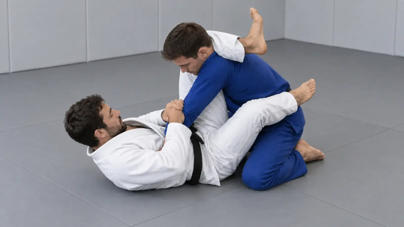 A guard player with a leg over the opponent’s shoulder, triangling the legs to trap the arm behind their back for an omoplata.