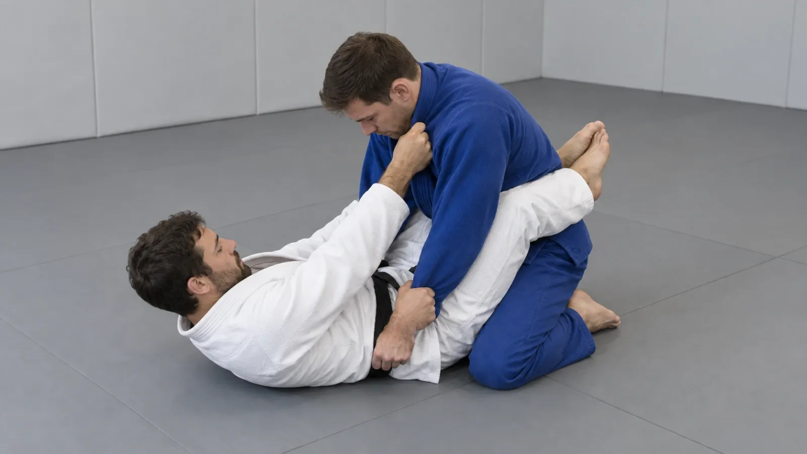 Closed guard with the opponent’s posture broken and their weight loaded forward over their knees.