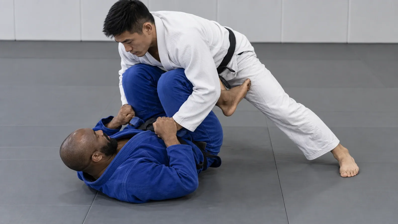 A top player folding an opponent onto their shoulders with the legs stacked above their head.