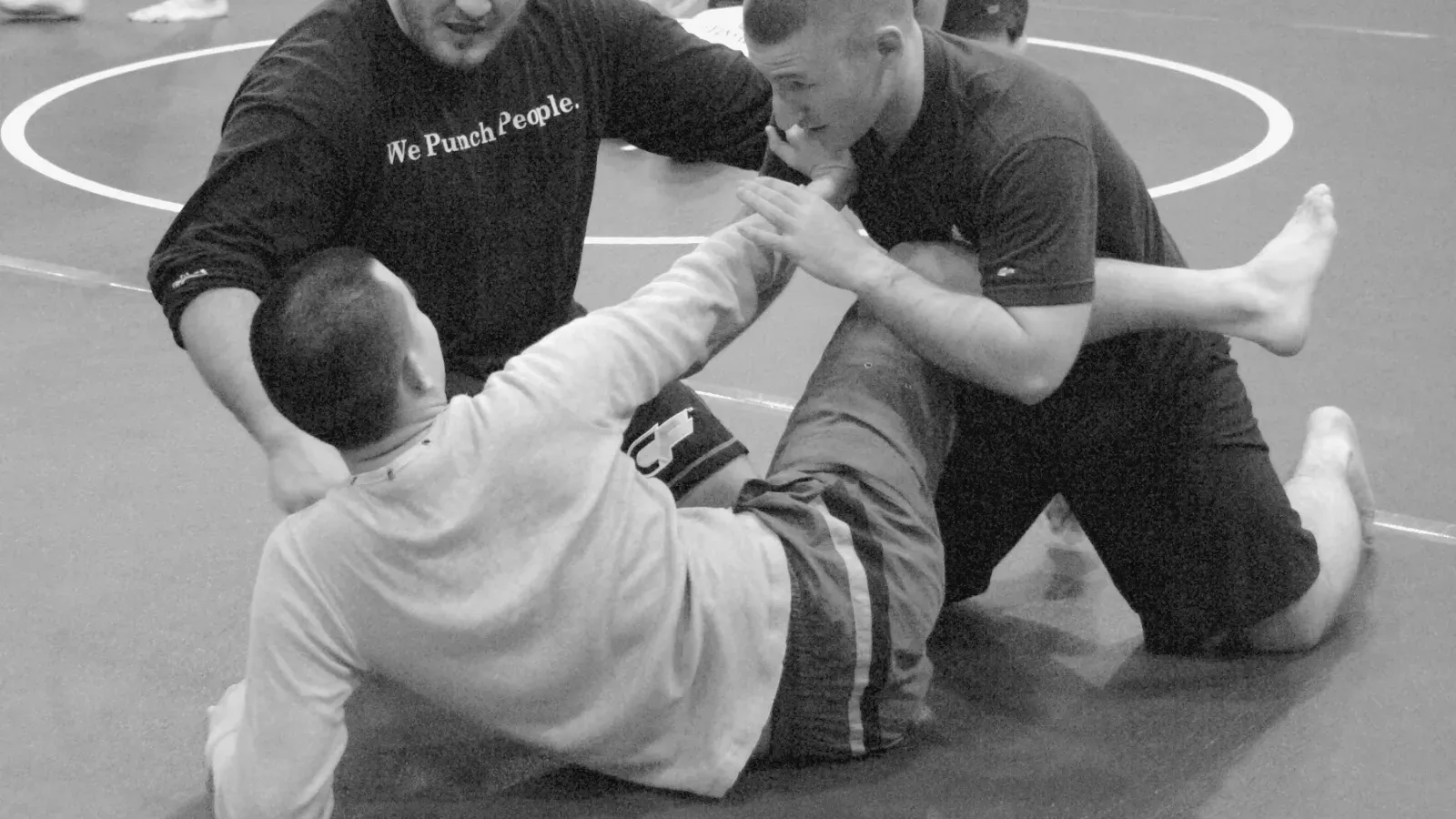 Brazilian Jiu Jitsu practitioners u s army ufc combatives training while training on the mat.