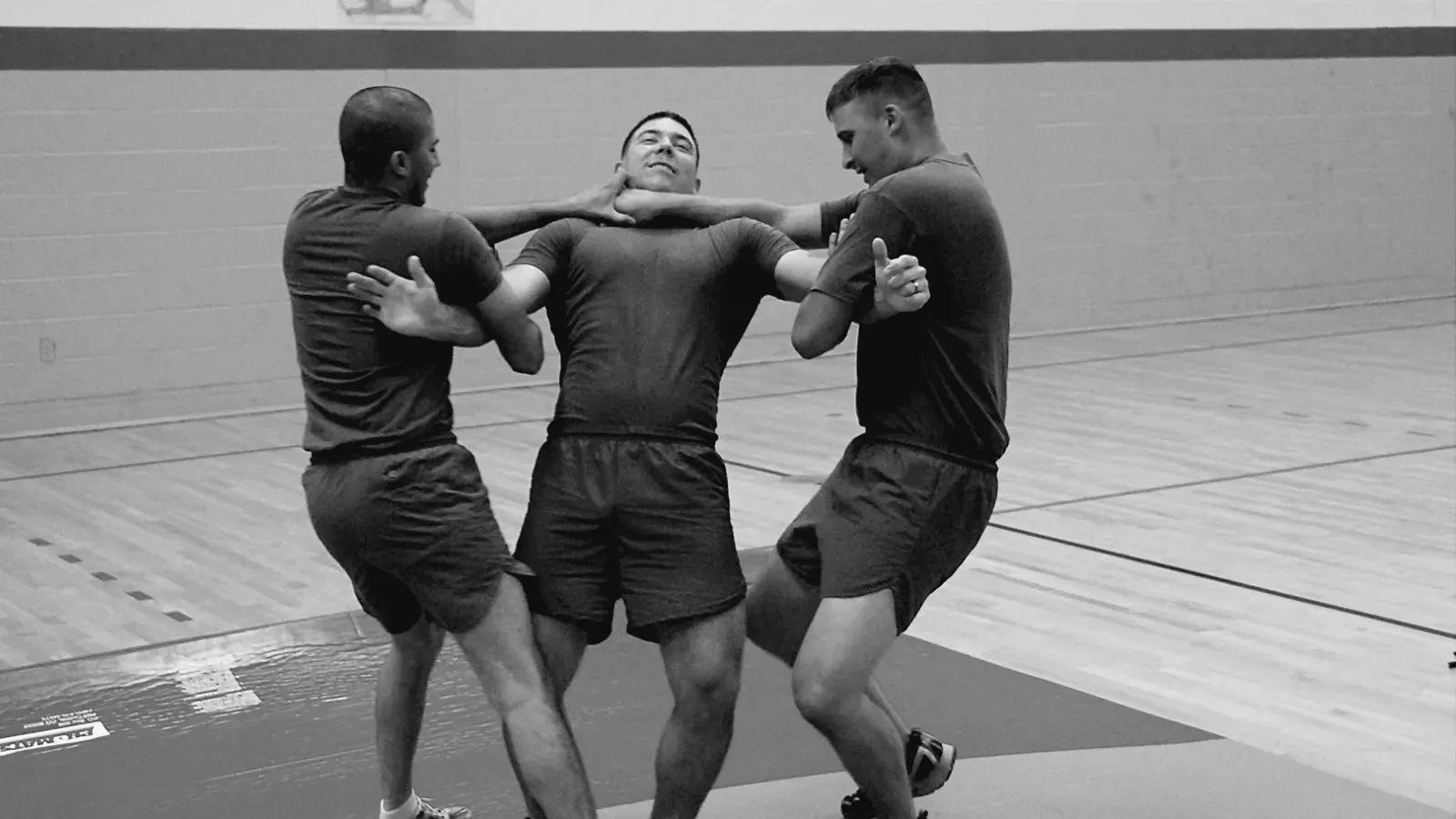 Brazilian Jiu Jitsu practitioners usmc 090728 m 6497h while training on the mat.